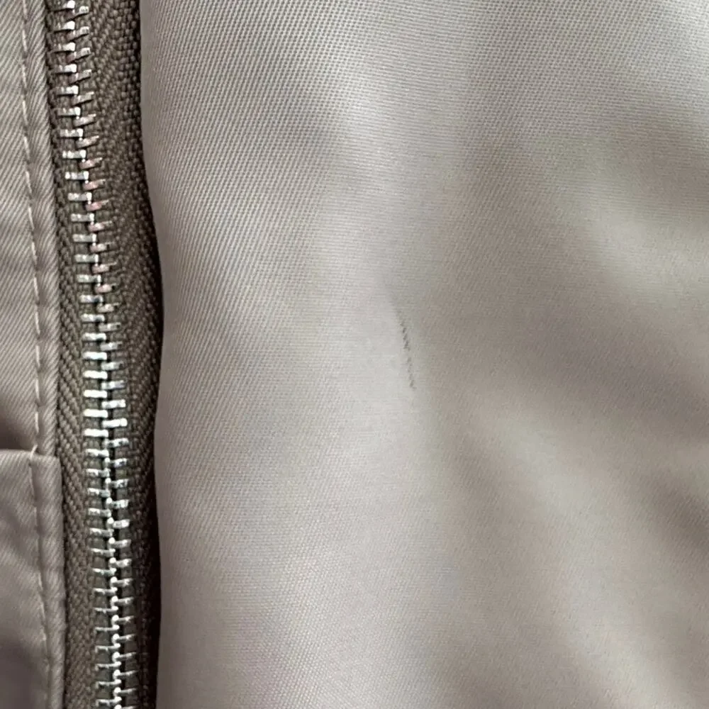 Neutral Taupe Woman’s Backpack with Metallic Accent and many zipper pockets. - Picture 9 of 13